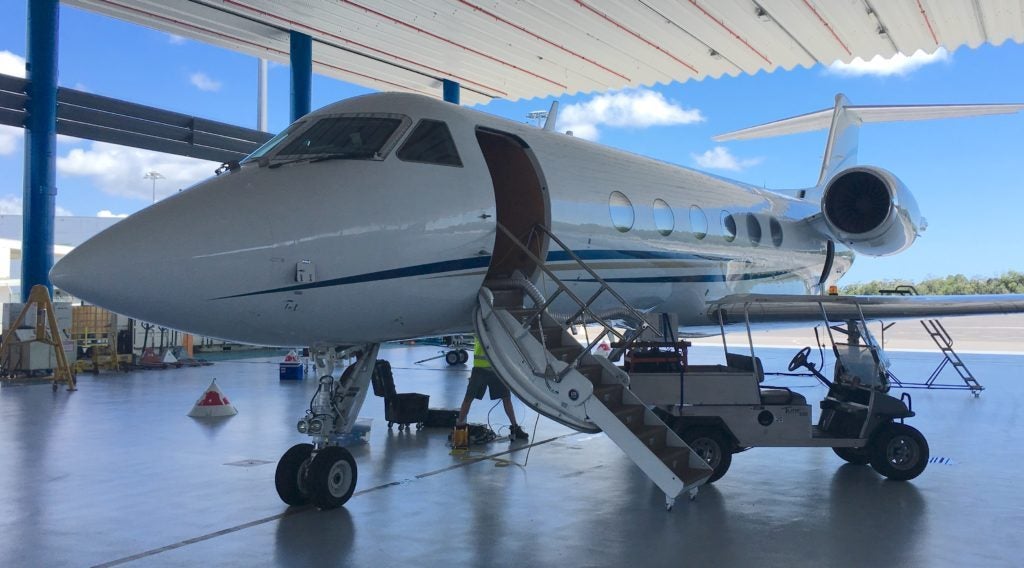 The Gulfstream IV plane carrying the Coral Reef Airborne Laboratory’s (CORAL) Portable Remote Imaging Spectrometer (PRISM) instrument sits in Hawker Pacific’s hangar at Cairns Airport. Credit: NASA/Alan Buis